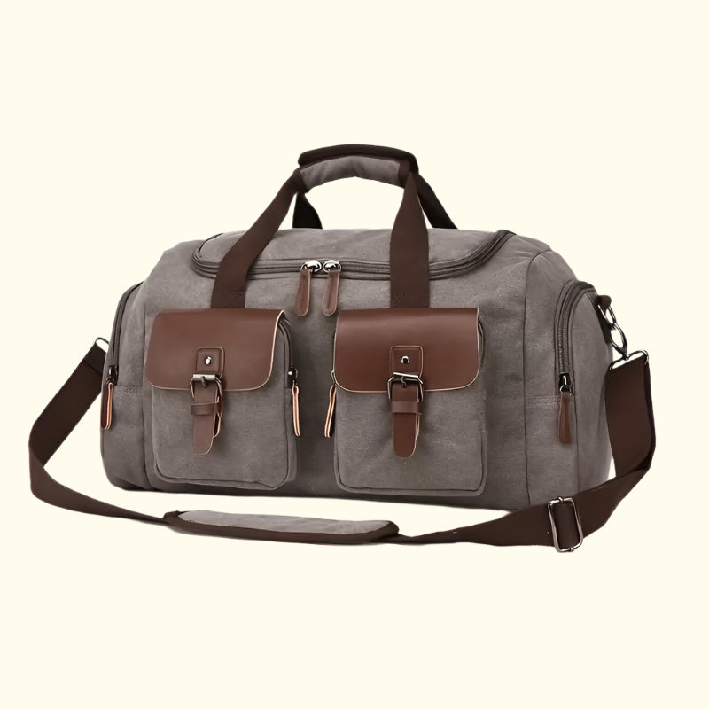 Gray duffel bag with brown accents on a white background