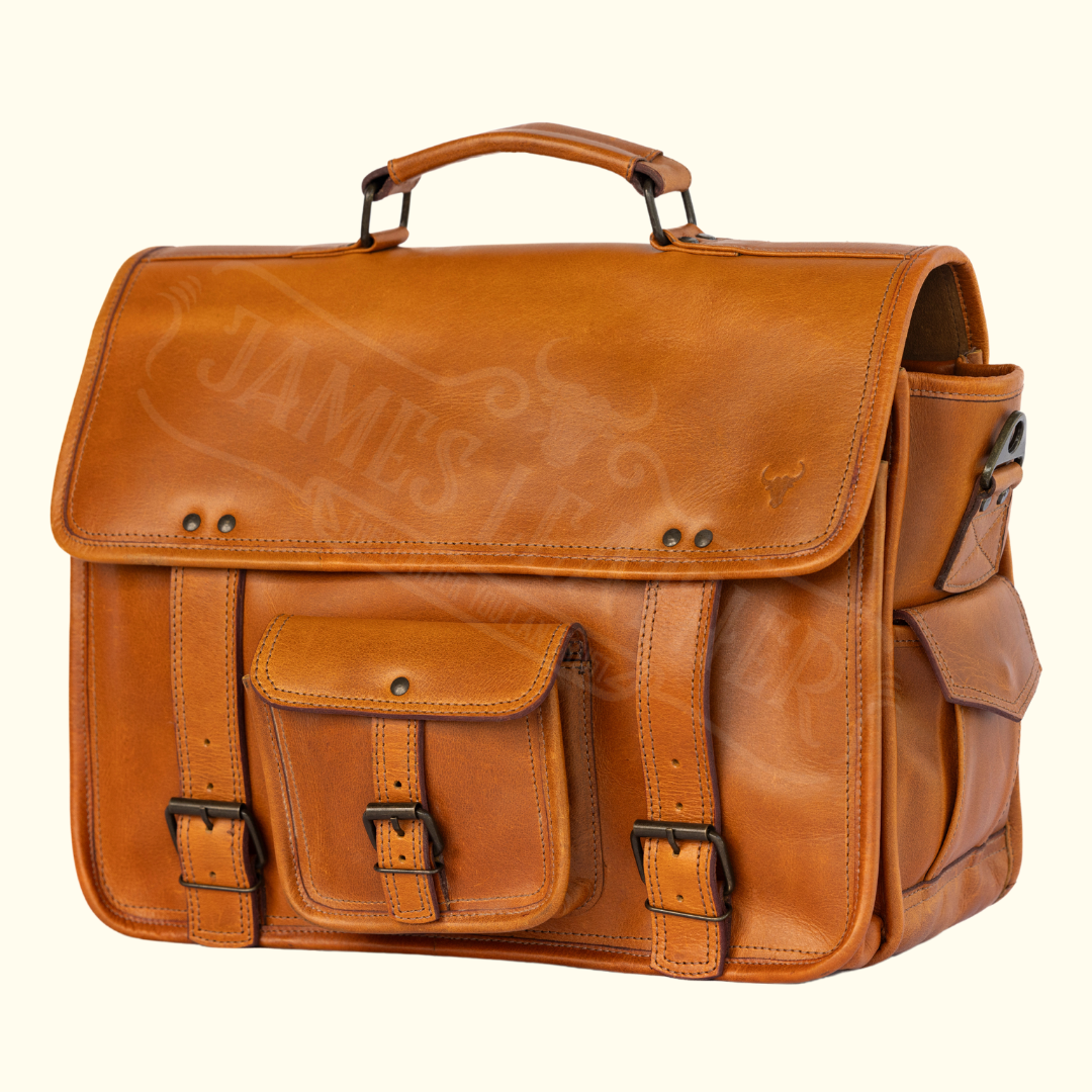 A brown Bison Heritage buffalo leather briefcase with a front pocket and secure closure, displayed against a white background.