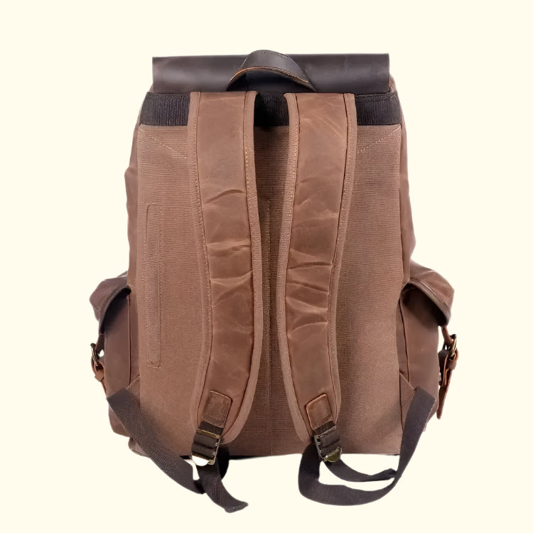 Brown backpack with black straps on a white background