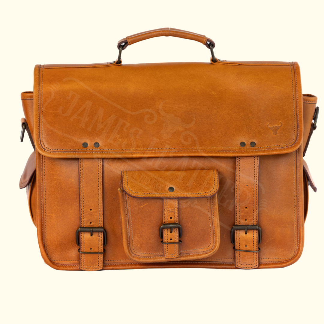 A caramel-hued buffalo leather briefcase with a solid handle and a front pocket, set against a white background.