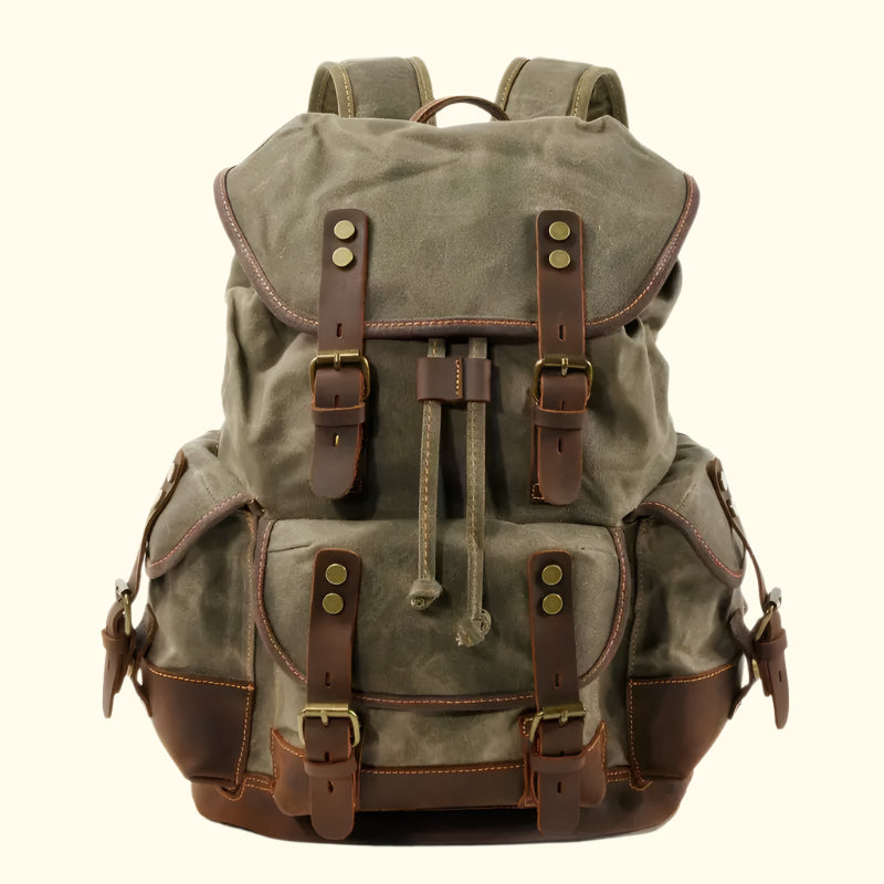 A green and brown Portland Vintage Canvas Travel Backpack with multiple pockets and adjustable straps.