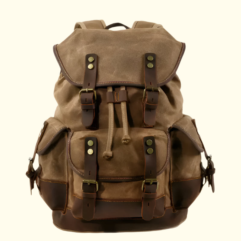 Brown backpack with leather straps on a white background