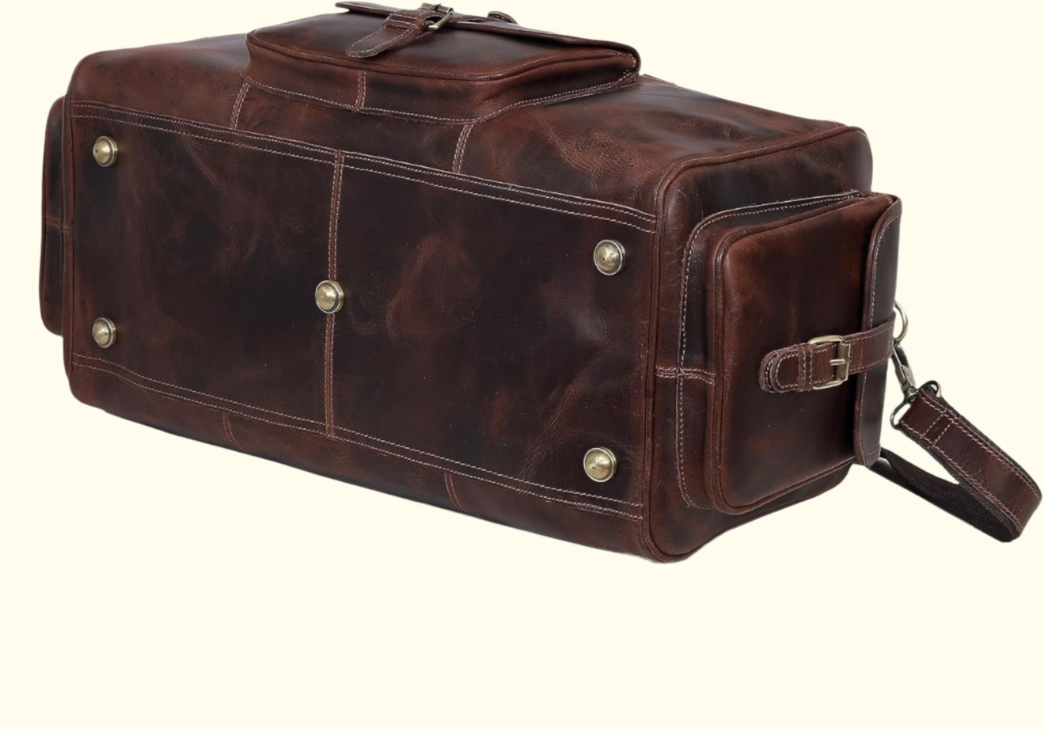 Brown leather duffel bag with silver studs on a white background