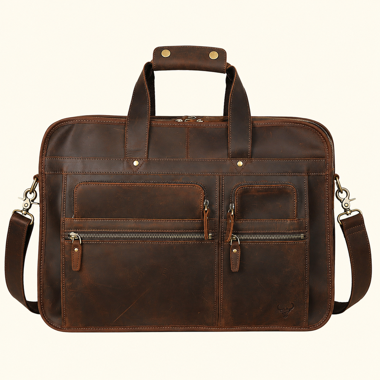 A dark brown distressed leather briefcase with dual top handles, a detachable shoulder strap, and multiple zippered front pockets, shown against a plain off-white background.