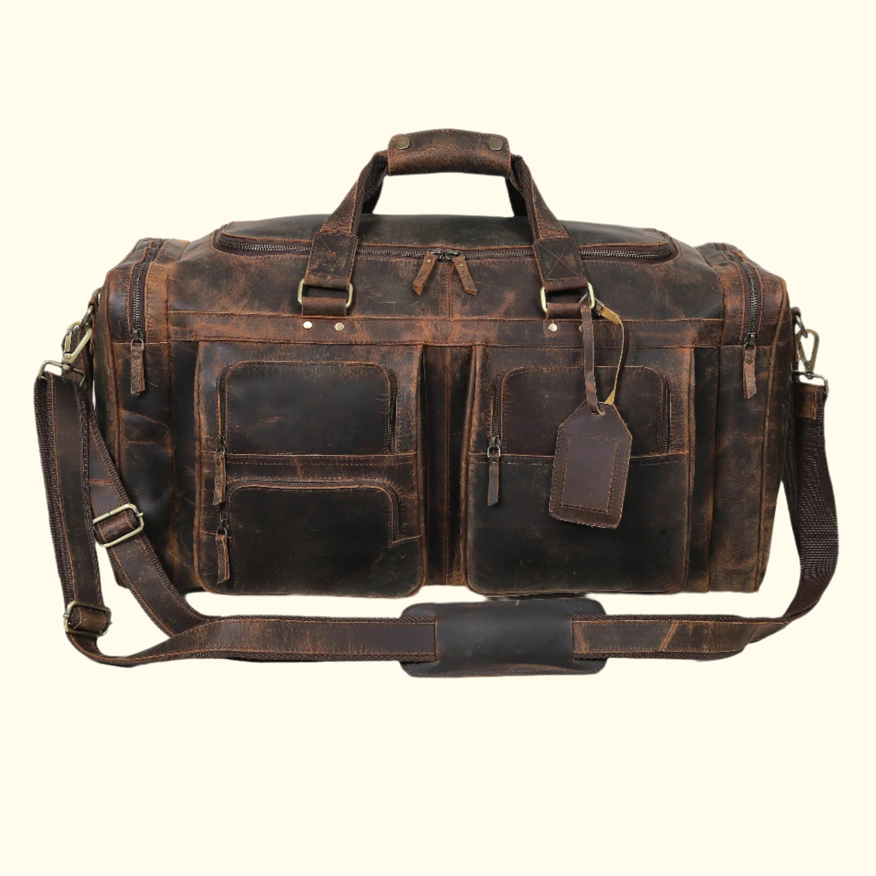 Brown leather duffel bag with multiple pockets and straps on a white background