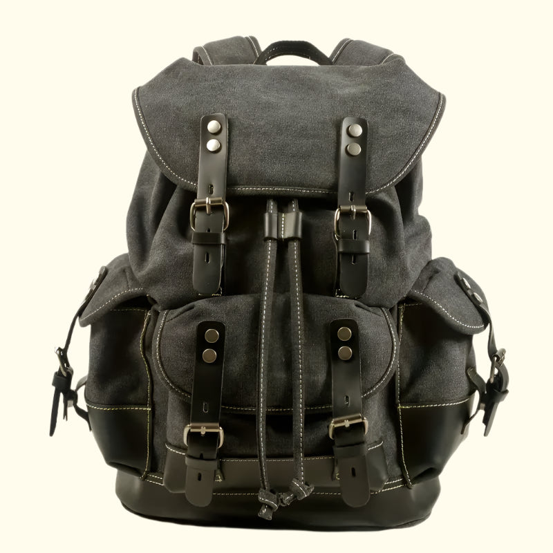 A green and brown Portland Vintage Canvas Travel Backpack with multiple pockets and adjustable straps.