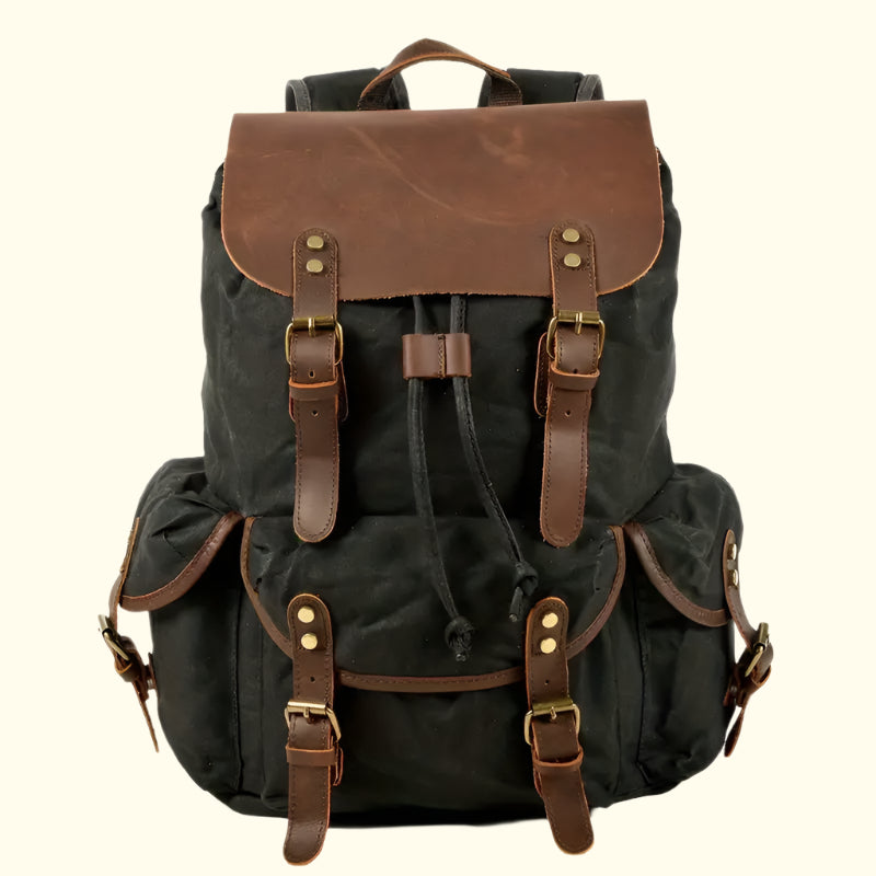Black backpack with brown leather straps and accents on a white background