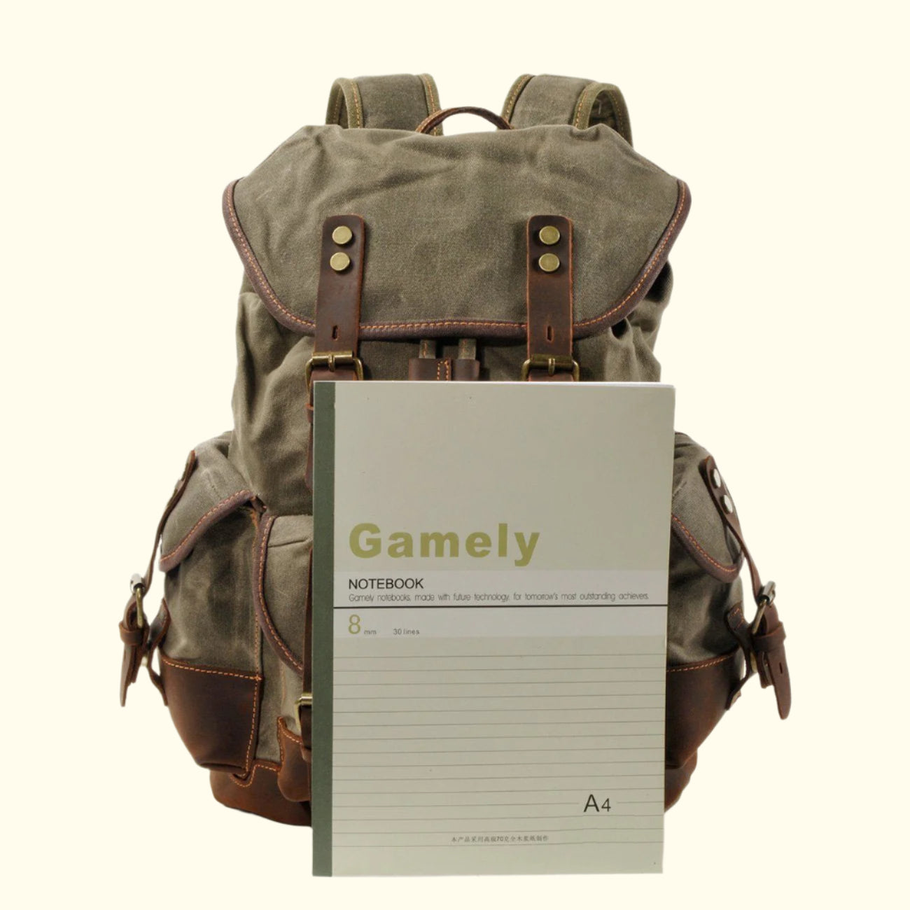 Brown backpack with a Gamely notebook on a white background