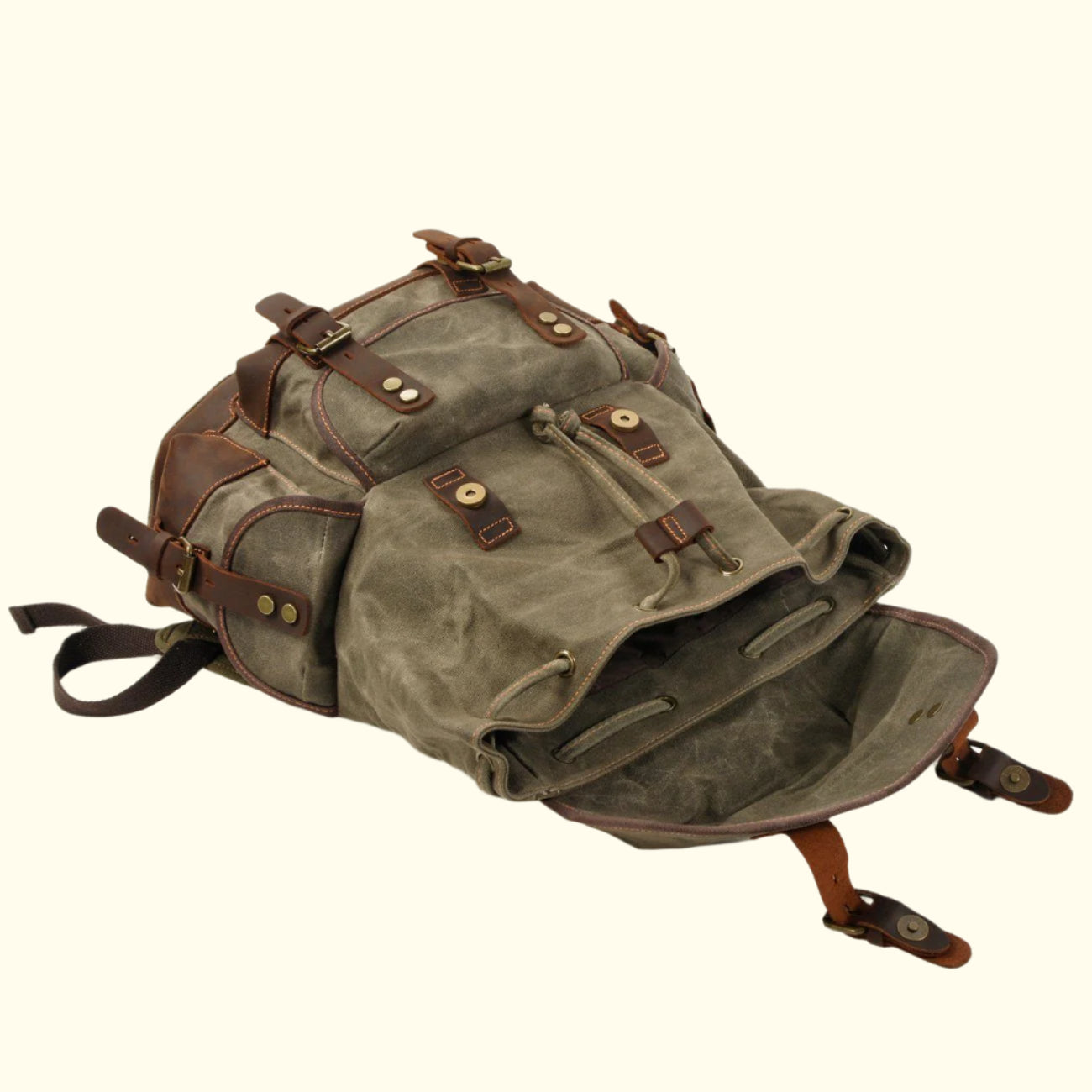 Vintage-style backpack with brown leather straps on a white background