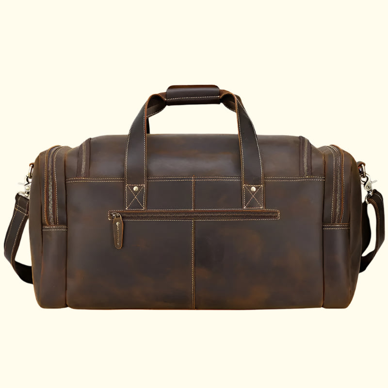 Brown leather duffel bag on a white background
