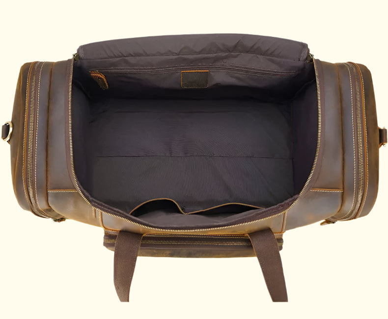 Brown leather duffel bag with open top on a white background