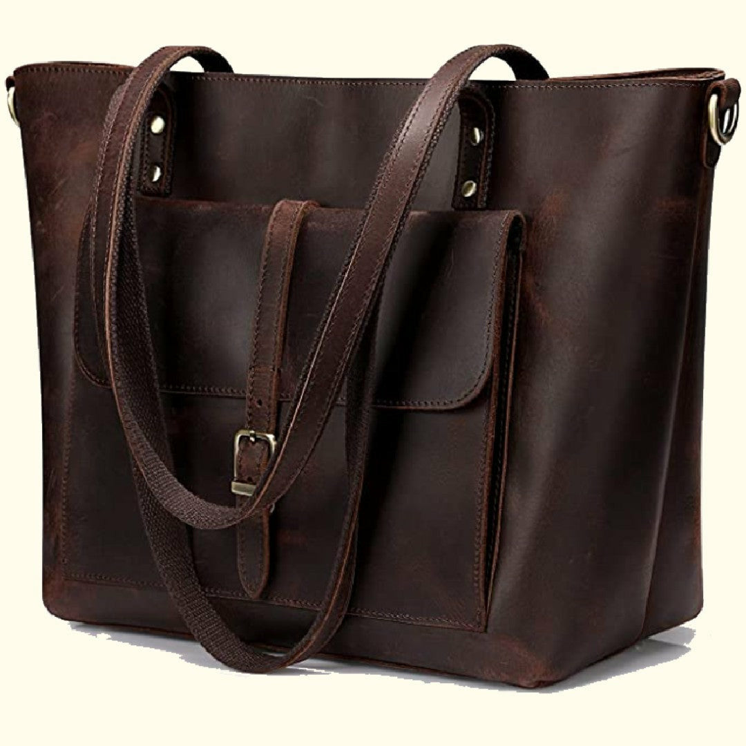 A dark brown Crazy Horse buffalo leather messenger bag with double top handles and a front flap with a buckle closure.