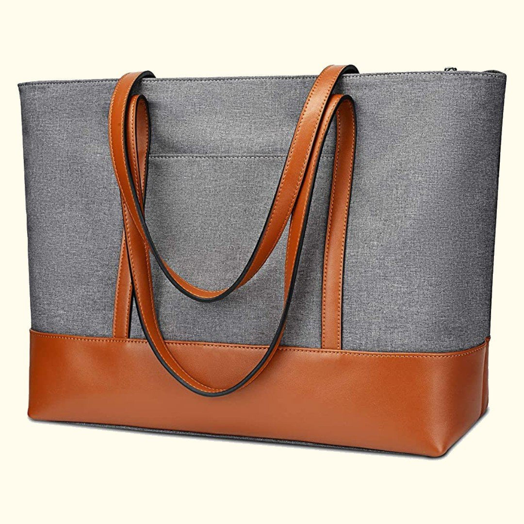 A gray and brown Belle Women Canvas Leather Tote Bag with top handles and a zippered closure.